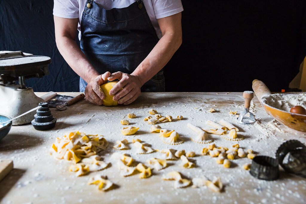 Italian chef Maurizio Bocchi making fresh pasta by hand