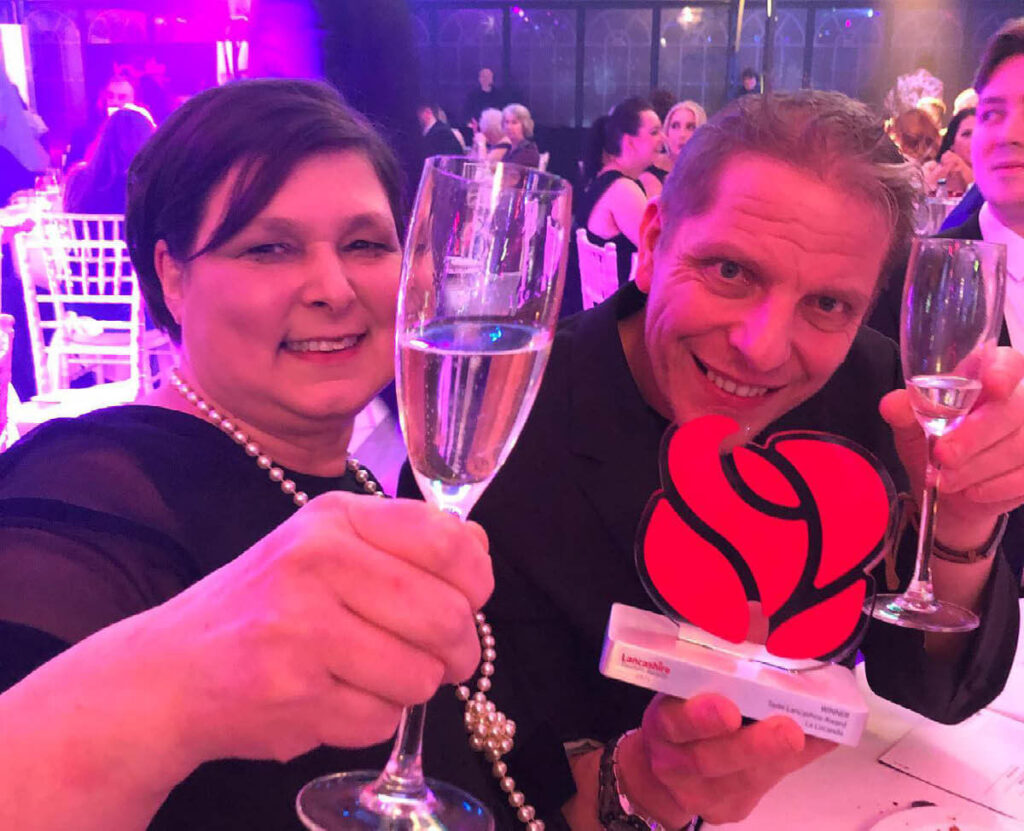 Cinzia and Maurizio Bocchi of La Locanda Italian restaurant in Lancashire celebrating their win at the Lancashire Tourism Awards 2021