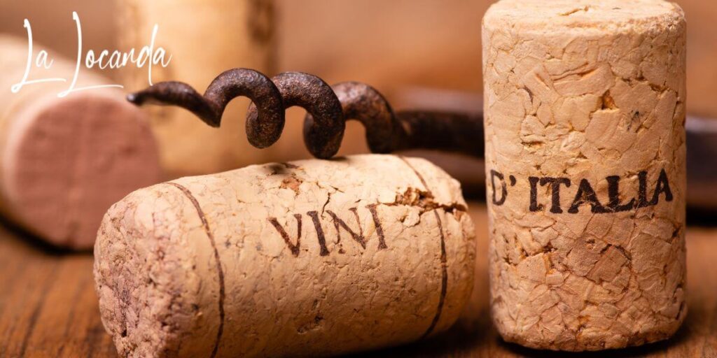 wine bottle corks and a rusty old corkscrew on a table