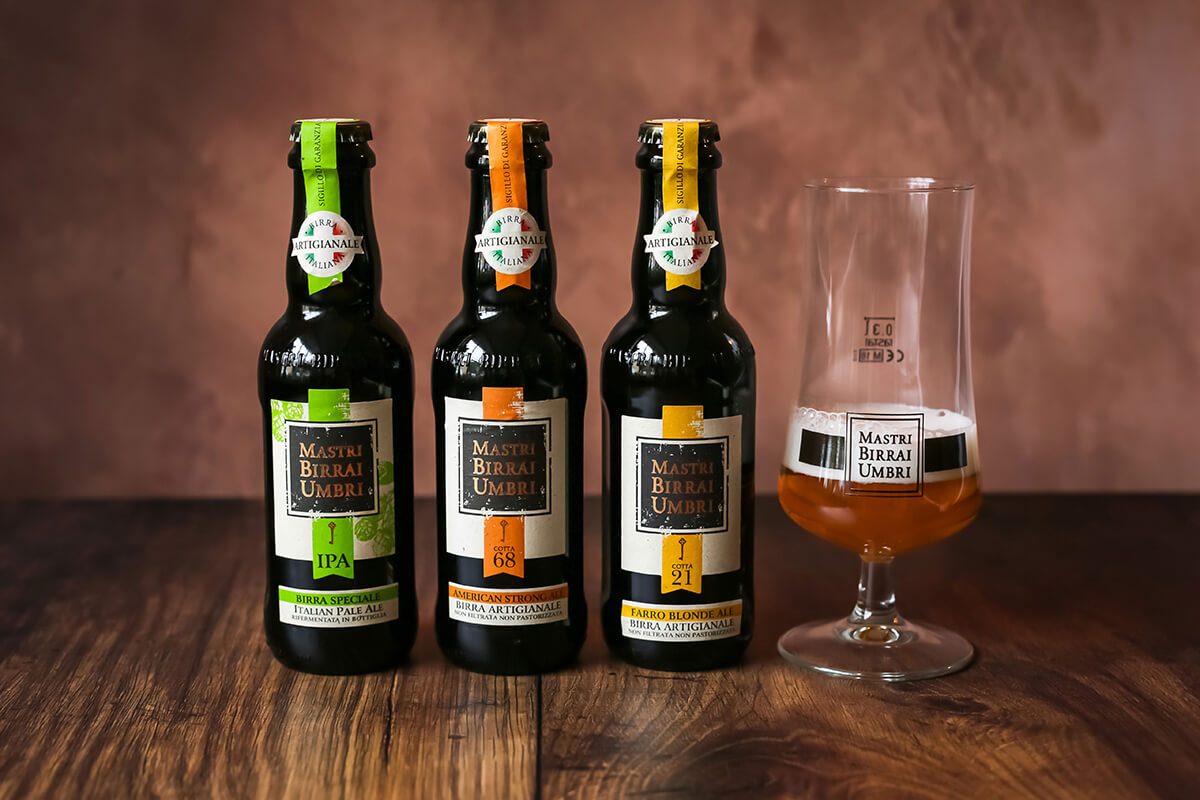 a selection of 3 Mastri Birrai Umbri Italain beers and official beer glass