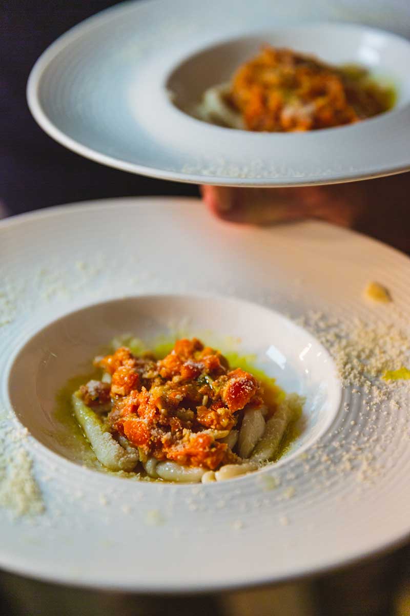 Busiate alla Trapanese, handcrafted Busiate pasta served with traditional pesto from Trapani
