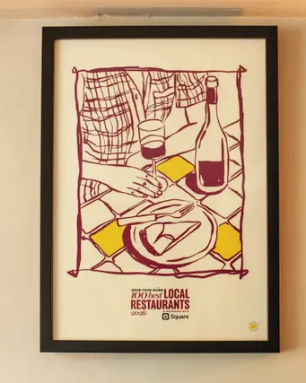 A framed award on the restaurant's wall - The Best Local Restaurant in Britain 2026 - La Locanda